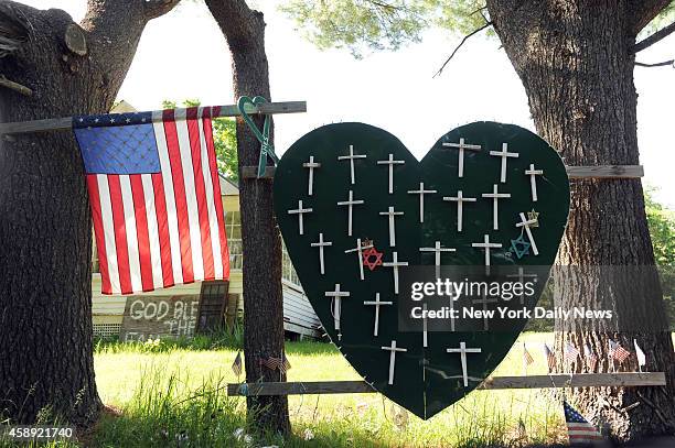 Sandy Hook Elementary School shooting, heart and cross memorial near Sandy Hook Firehouse on Riverside Road in Sandy Hook, CT