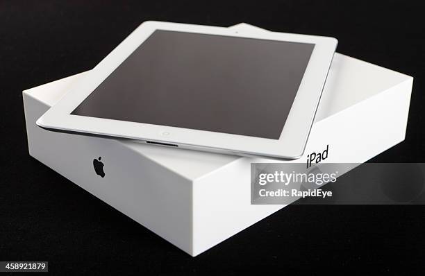 new tablet on packaging with apple and ipad logos visible - apple box stock pictures, royalty-free photos & images