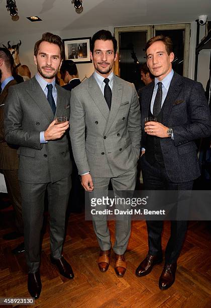 Luke Sweeney, David Gandy and Thom Whiddett attend the opening of the new Thom Sweeney RTW & MTM Store on November 13, 2014 in London, England.