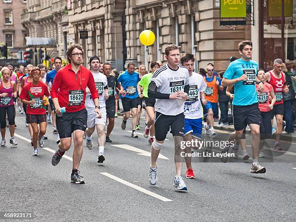 runners participating in great scottish run 2012 - marathon stock pictures, royalty-free photos & images