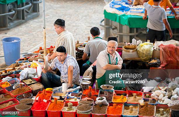 men behind their seasoning stands - uzbekistan market stock pictures, royalty-free photos & images