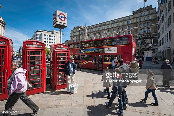 london red phone boxes double decker buses on strand - the strand london stock pictures, royalty-free photos & images