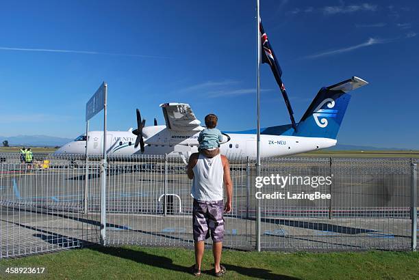 man and boy with an air new zealand aeroplane - flying kiwi stock pictures, royalty-free photos & images