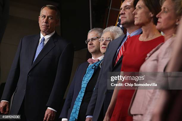 Speaker of the House John Boehner stands with the newly-elected members of the House GOP leadership team during a news conference at the U.S. Capitol...