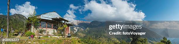 children doing schoolwork outside nepali farmhouse himalaya mountains - foothills stock pictures, royalty-free photos & images