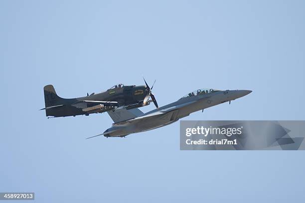 f-16 and a-1 skyraider in flight - lockheed stock pictures, royalty-free photos & images