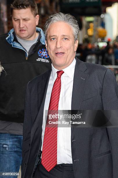 Television personality Jon Stewart enters the "Late Show With David Letterman" taping at the Ed Sullivan Theater on November 13, 2014 in New York...