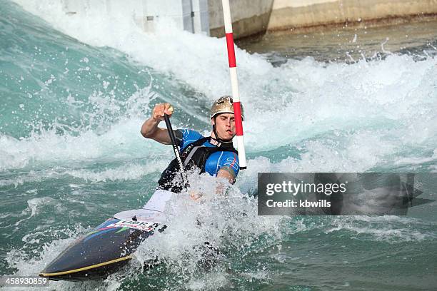 kayak and canoeist navigates white water rapids in slalom course - 奧運會 個照片及圖片檔