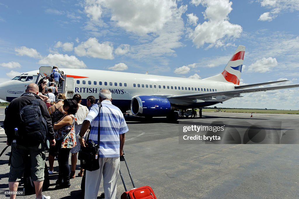 Tourist boarding British Airways Boeing 737-300, Victoria Falls,Zimbabwe
