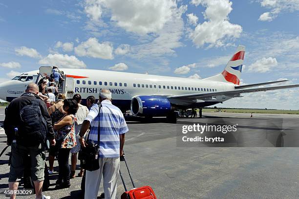 tourist boarding british airways boeing 737-300, victoria falls,zimbabwe - british airways stock pictures, royalty-free photos & images