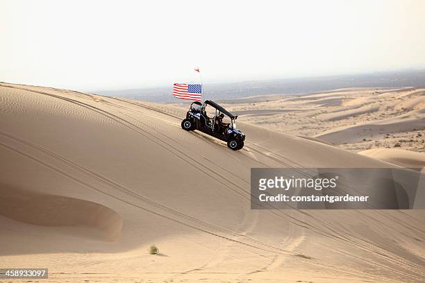 proudly american on the imperial sand dunes. - atv sand dune stock pictures, royalty-free photos & images