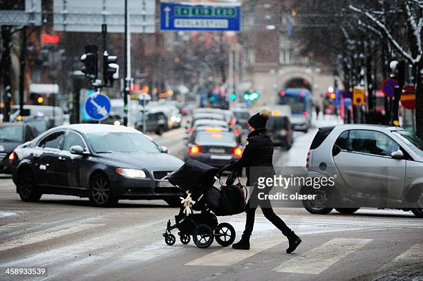 woman on winter zebra crossing - pedestrian winter stock pictures, royalty-free photos & images