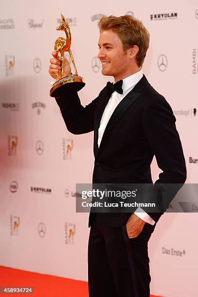 Nico Rosberg poses with his award during Kryolan at the Bambi Awards 2014 on November 13, 2014 in Berlin, Germany.