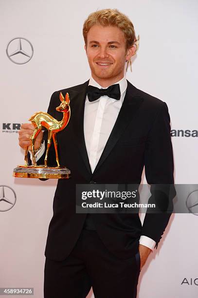 Nico Rosberg poses with his award during Kryolan at the Bambi Awards 2014 on November 13, 2014 in Berlin, Germany.