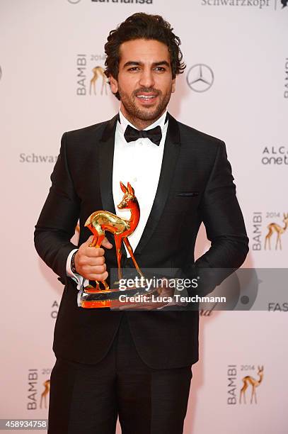 Elyas M'Barek poses with his award during Kryolan at the Bambi Awards 2014 on November 13, 2014 in Berlin, Germany.