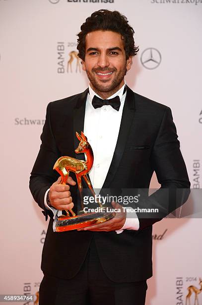 Elyas M'Barek poses with his award during Kryolan at the Bambi Awards 2014 on November 13, 2014 in Berlin, Germany.