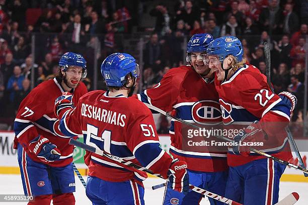 Max Pacioretty of the Montreal Canadiens celebrates with Dale Weise, David Desharnais and Tom Gilbert after scoring a goal against the Boston Bruins...