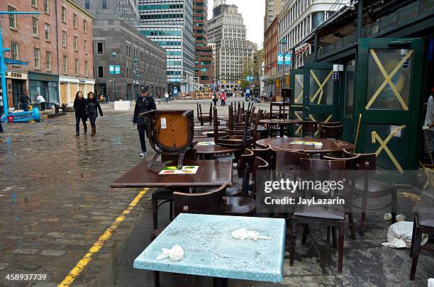 hurricane sandy aftermath, damaged restaurant furniture, lower manhattan, nyc - boarded up stock pictures, royalty-free photos & images