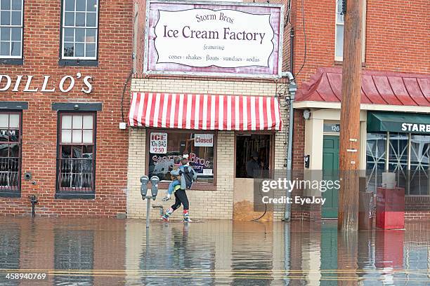 hurricane sandy flood closes businesses at annapolis harbor - hurricane sandy bildbanksfoton och bilder