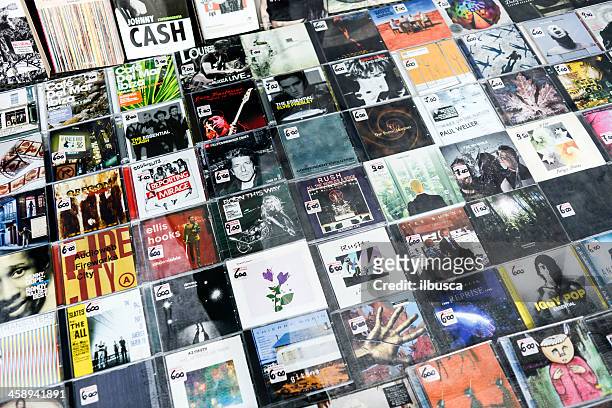 several cds from different artists in a store window - rom stock pictures, royalty-free photos & images