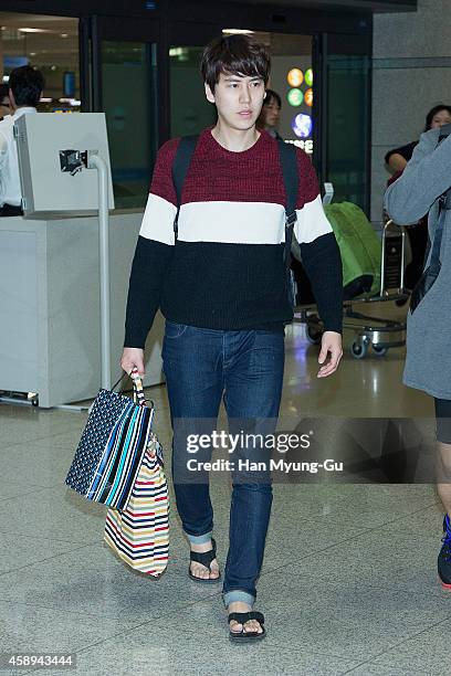 Kyuhyun of South Korean boy band Super Junior is seen upon arrival at Incheon International Airport on November 12, 2014 in Incheon, South Korea.