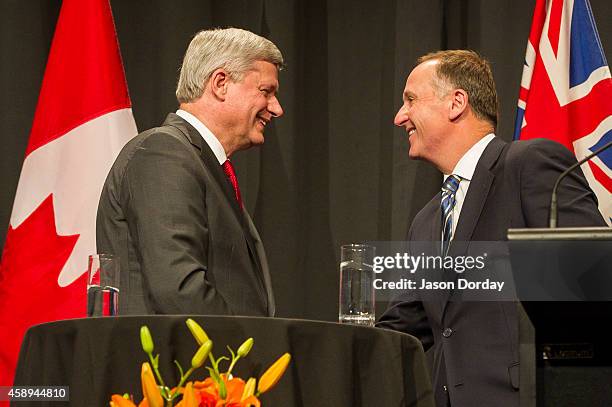 Prime Minister Of Canada Stephen Harper and Prime Minister of New Zealand John Key take part in a joint press conference at the Sky City Grand Hotel...