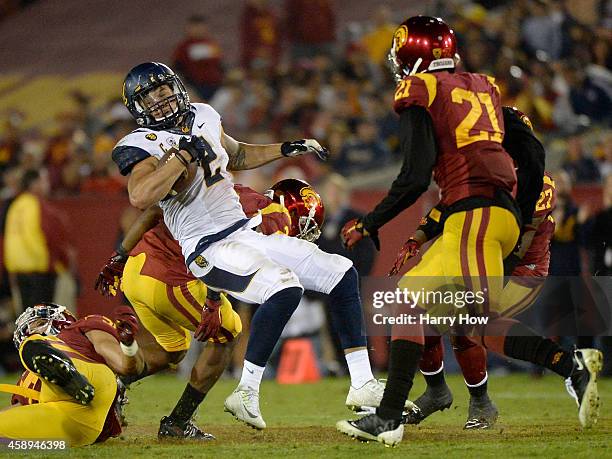 Daniel Lasco of the California Golden Bears gets past Su'a Cravens of the USC Trojans at Los Angeles Memorial Coliseum on November 13, 2014 in Los...