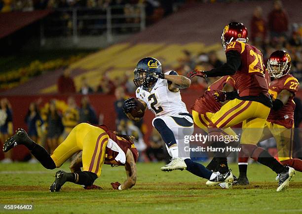 Daniel Lasco of the California Golden Bears gets past Su'a Cravens of the USC Trojans at Los Angeles Memorial Coliseum on November 13, 2014 in Los...