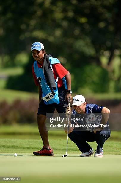 Scott Barr of Australia plays a shot during round two of the Chiangmai Golf Classic at Alpine Golf Resort-Chiangmai on November 14, 2014 in Chiang...