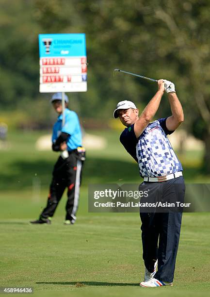 Scott Barr of Australia plays a shot during round two of the Chiangmai Golf Classic at Alpine Golf Resort-Chiangmai on November 14, 2014 in Chiang...