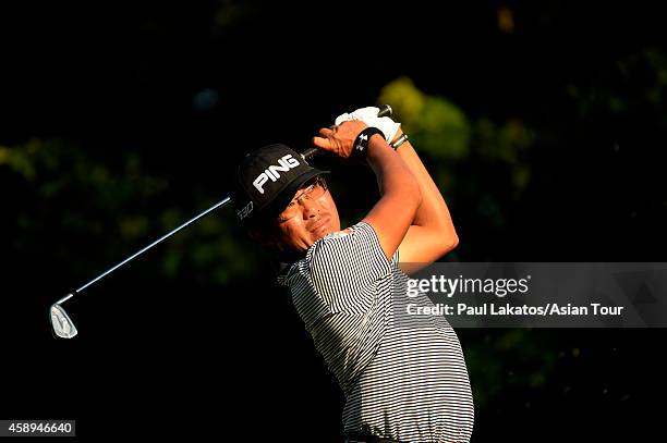 Nicholas Fung of Malaysia plays a shot during round two of the Chiangmai Golf Classic at Alpine Golf Resort-Chiangmai on November 14, 2014 in Chiang...