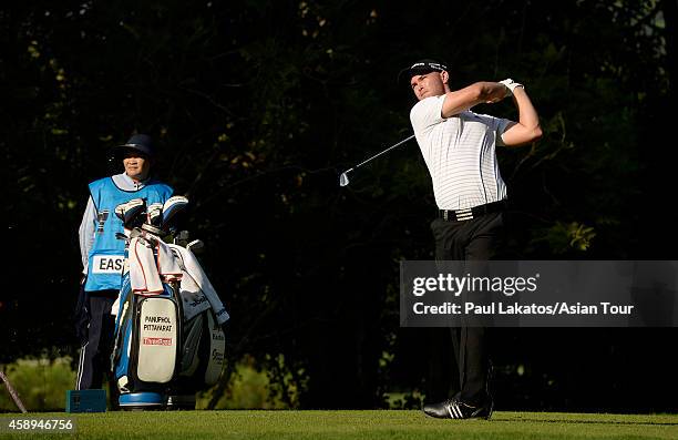 Bryce Easton of South Africa plays a shot during round two of the Chiangmai Golf Classic at Alpine Golf Resort-Chiangmai on November 14, 2014 in...