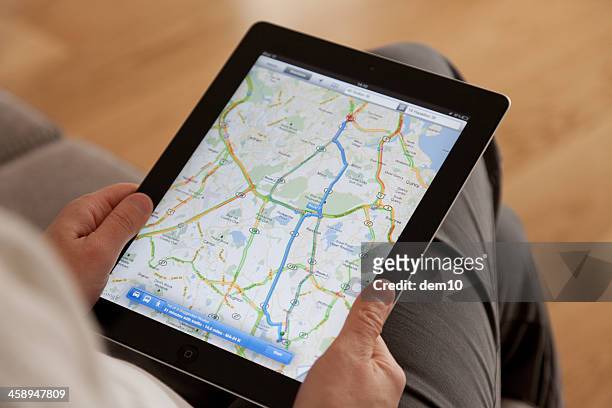 google maps on a apple ipad screen - google map stock pictures, royalty-free photos & images