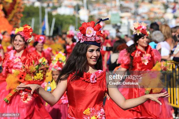 women dancers at madeira flower festival parade, portugal - carnival in portugal stock pictures, royalty-free photos & images