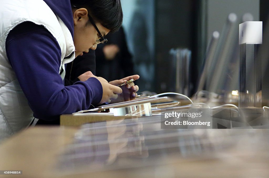 Shoppers And Product Displays Inside The Apple Inc. Store At China Central Mall