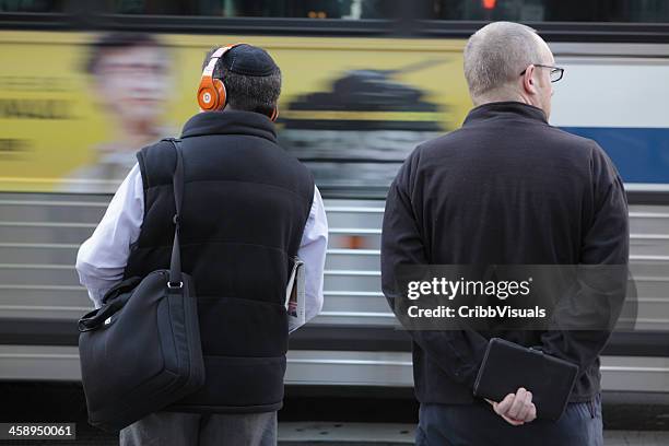 nyc two men waiting to cross 34th street - jewish people stock pictures, royalty-free photos & images