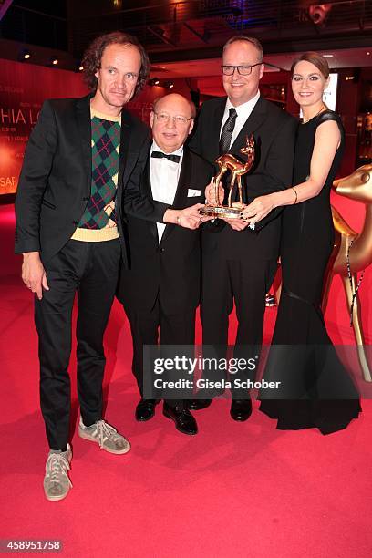 Cast members of the tv show 'heute show', Olaf Schubert, Hans-Joachim Heist, Oliver Welke and Martina Hill pose with their award during Kryolan at...