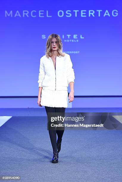 Model Julia Trainer walks the runway at the Marcel Ostertag Charity Fashion Show at Sofitel Munich Bayerpost on November 13, 2014 in Munich, Germany.