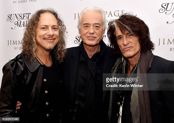 Musicians Kirk Hammett, Jimmy Page and Joe Perry pose at a private reception and dinner for Jimmy Page to celebrate his new autobiography "Jimmy Page...