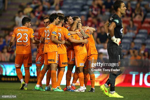 Roar players celebrate a goal during the round six A-League match between the Newcastle Jets and Brisbane Roar at Hunter Stadium on November 14, 2014...