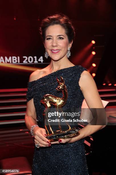 Crown Princess Mary of Denmark poses with her award during the Bambi Awards 2014 show on November 13, 2014 in Berlin, Germany.