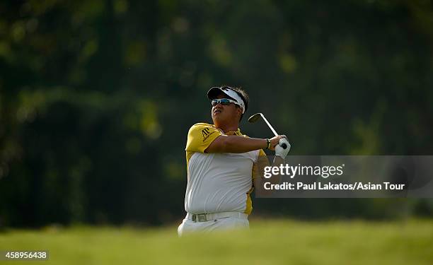 Kiradech Aphibarnrat of Thailand plays a shot during round two of the Chiangmai Golf Classic at Alpine Golf Resort-Chiangmai on November 14, 2014 in...