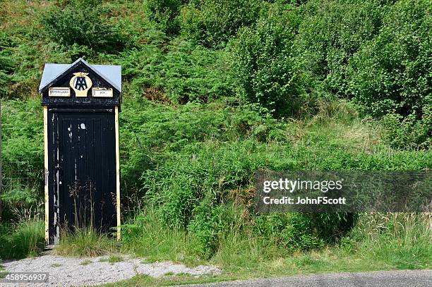 old style aa box on a remote road in scotland - emergency telephone box stock pictures, royalty-free photos & images