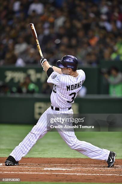 Justin Morneau of the Colorado Rockies hits two-run homer in the second inning during the game two of Samurai Japan and MLB All Stars at Tokyo Dome...