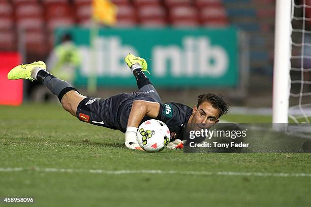 Jets goalkeeper Mark Birighitti saves a penalty during the round six A-League match between the Newcastle Jets and Brisbane Roar at Hunter Stadium on...