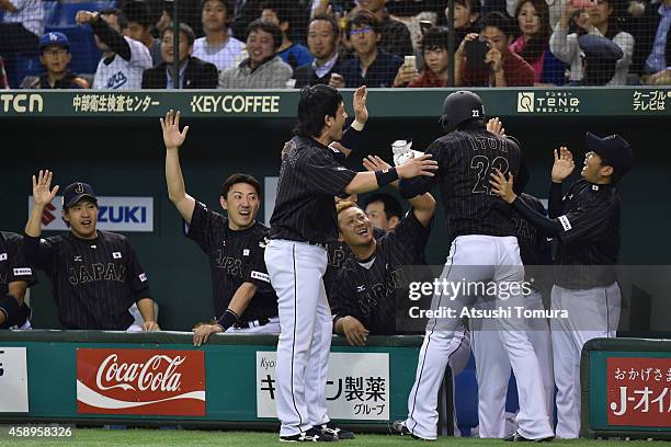 Hikaru Ito of Samurai Japan celebrates after scoring in the second inning during the game two of Samurai Japan and MLB All Stars at Tokyo Dome on...