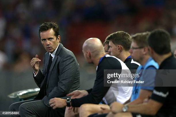 Mike Mulvey coach of the Roar talks to his bench during the round six A-League match between the Newcastle Jets and Brisbane Roar at Hunter Stadium...