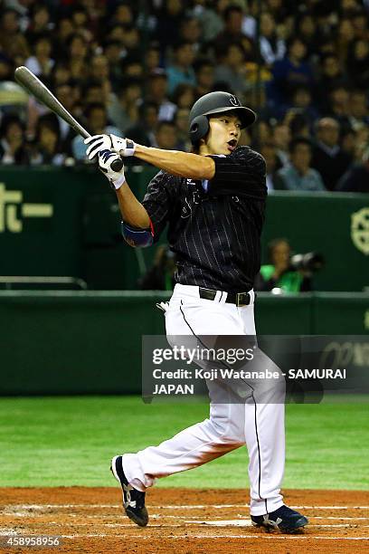 Yuki Yanagita of Samurai Japan hits to the right field sending one runner home in the fourth inning during the game two of Samurai Japan and MLB All...