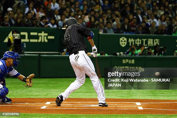 Yuki Yanagita of Samurai Japan hits to the right field sending one runner home in the fourth inning during the game two of Samurai Japan and MLB All...