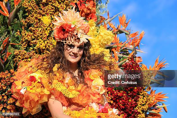 costumed young woman at madeira flower festival parade, portugal - madeira stock pictures, royalty-free photos & images